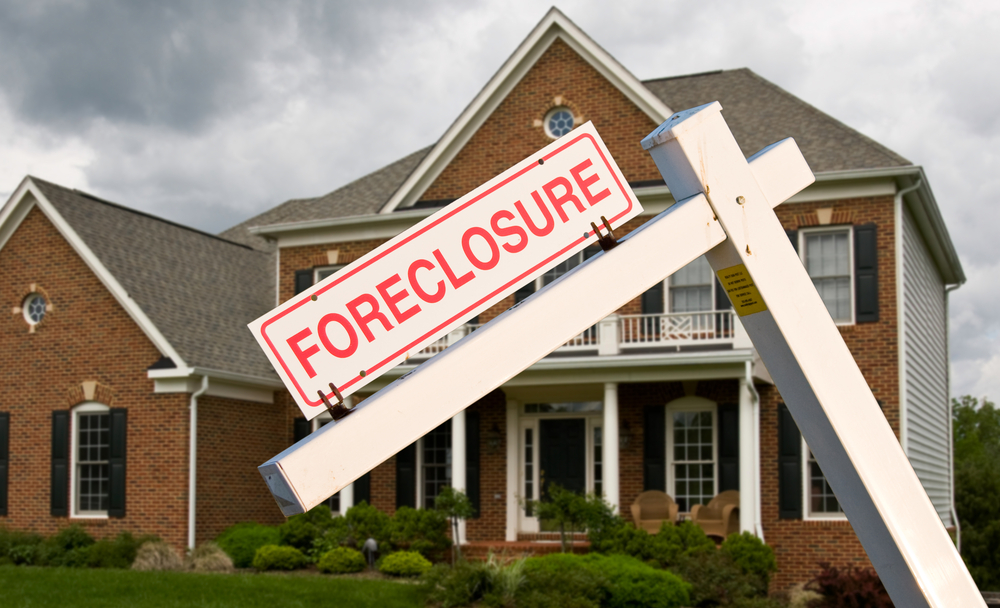 Foreclosure sign in front yard
